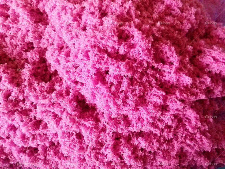 pink texture. close up of kinetic sand
