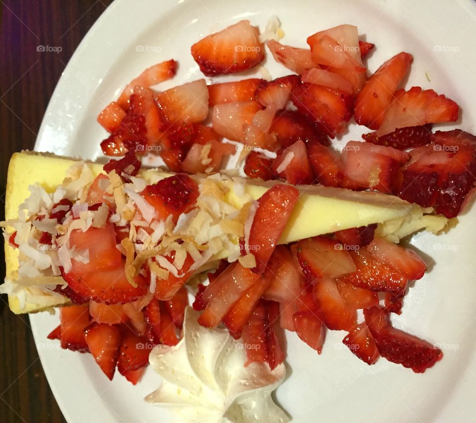 
FRUITS - Strawberries surrounding cheese cake - Fruits are an excellent source of essential vitamins and minerals, and they are high in fiber which helps reduce a persons risk of fevers heart attack