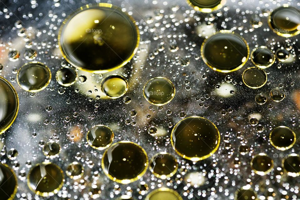 Oil golden bubbles close up background amazing droplets with colours trippy psychedelic minimalist art attack making wonderful view