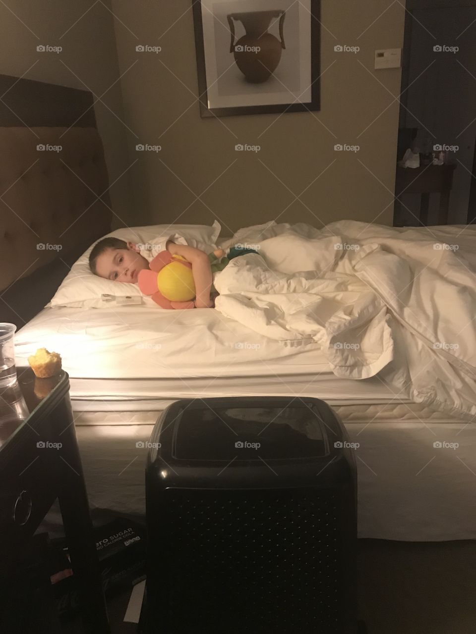 Sleeping boy with his stuff is