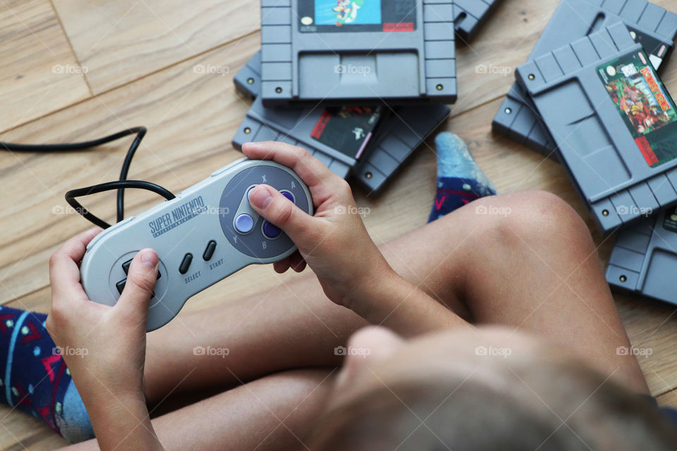 Child playing Super Nintendo