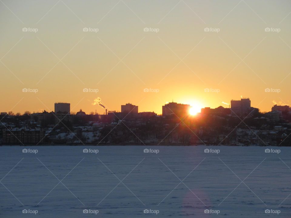 severe winter sky, sunset over the city, frost