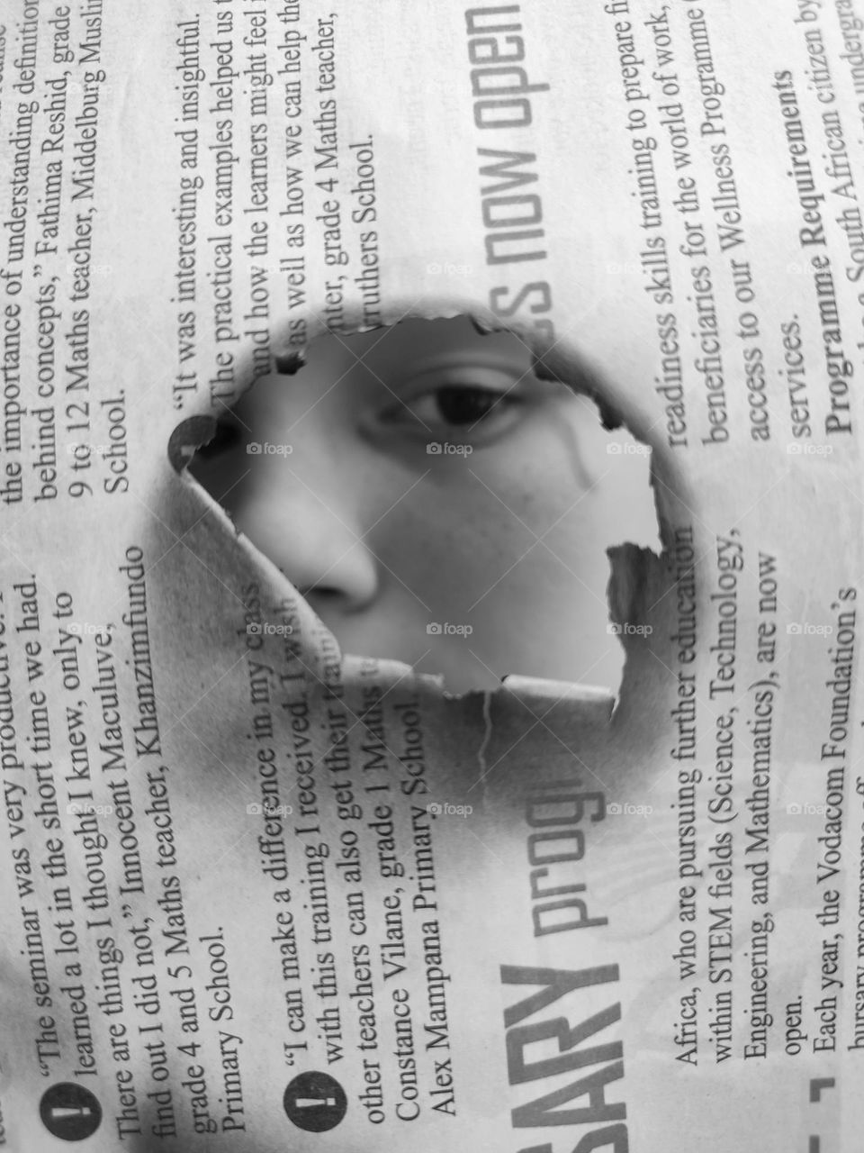 Looking through newspaper