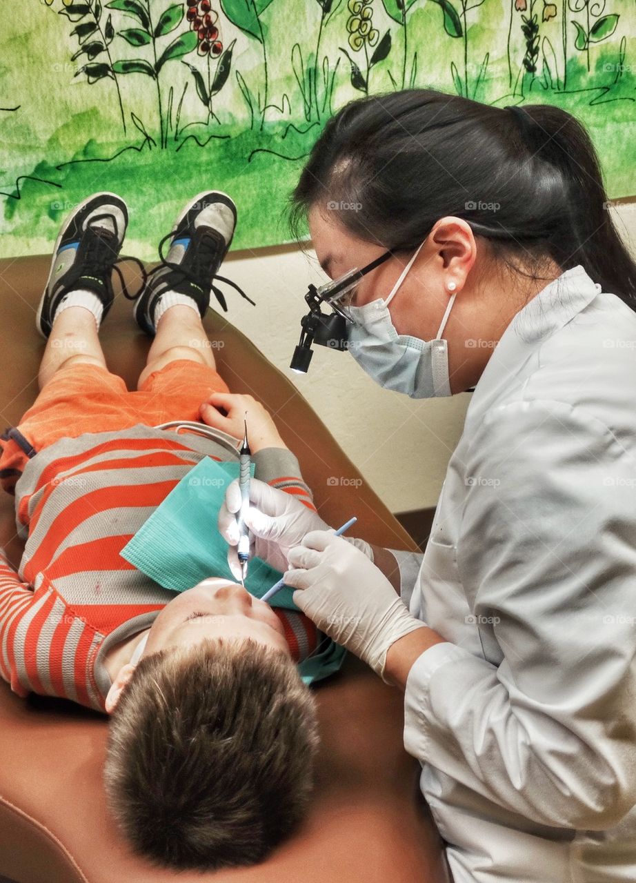 Young Boy Visiting The Dentist. First Visit To See The Dentist
