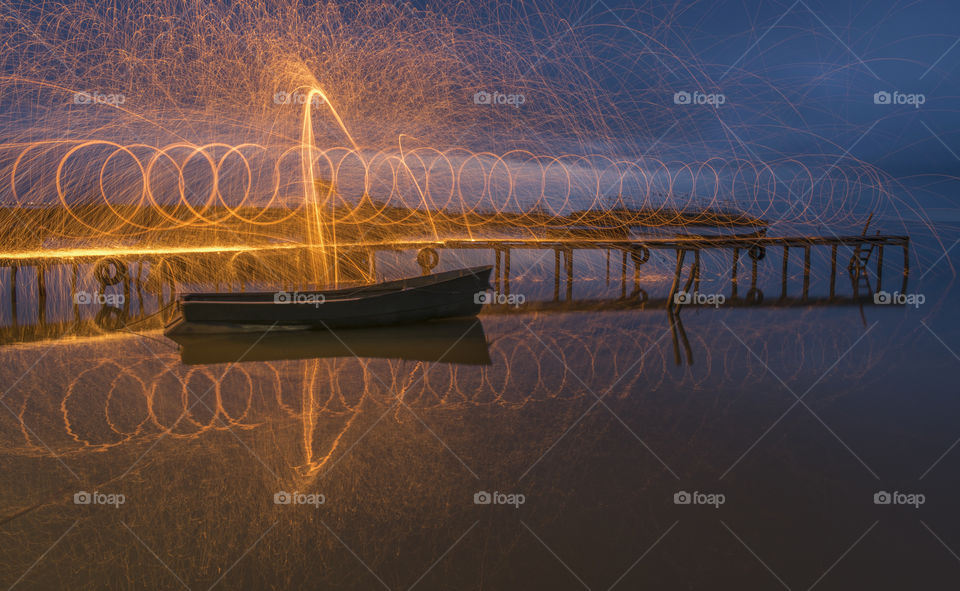 Light painting on pontoon and fishing boat.