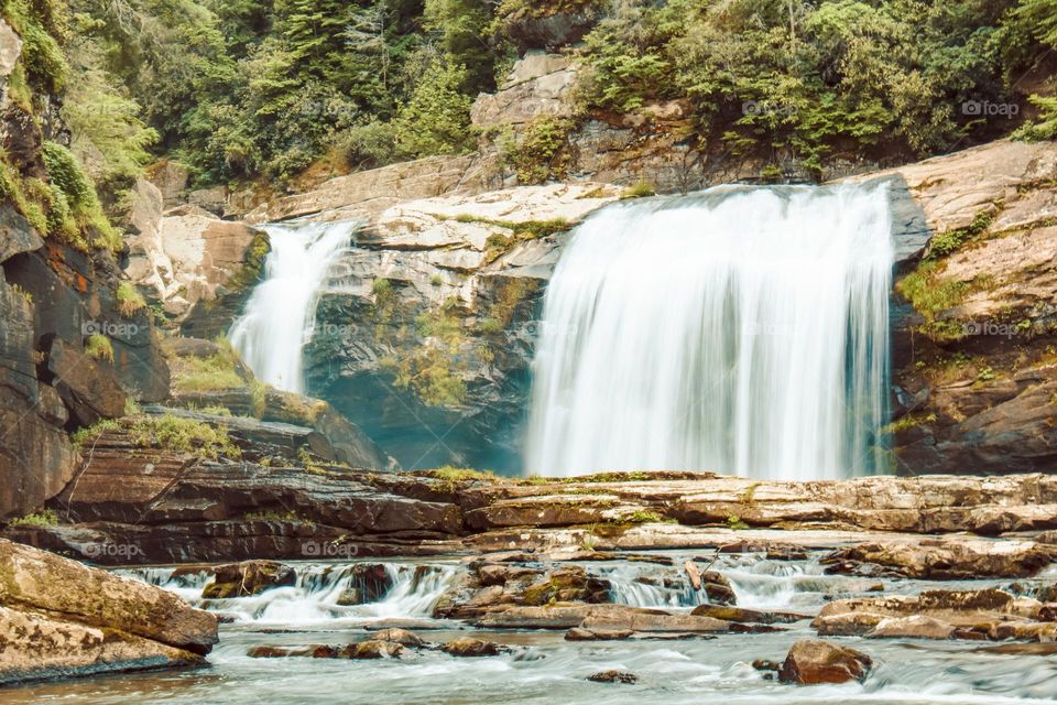 beautiful waterfall in the middle of the forest