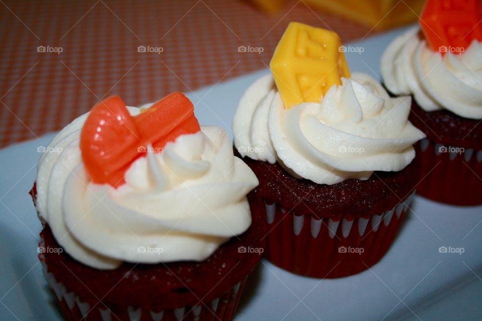 Red Velvet. Red velvet cupcakes with buttercream icing topped with white chocolate baby decorations