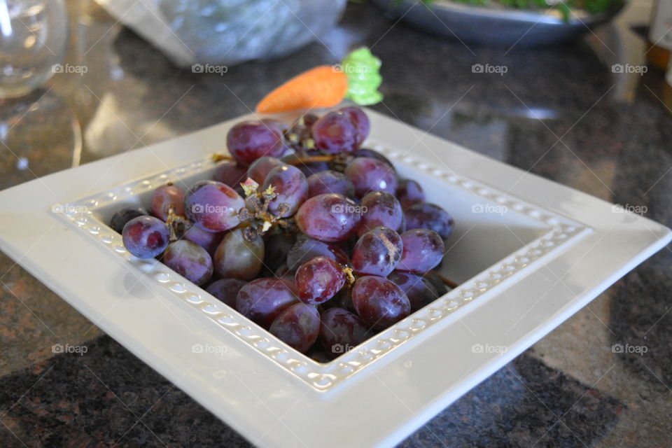 grapes in white plate