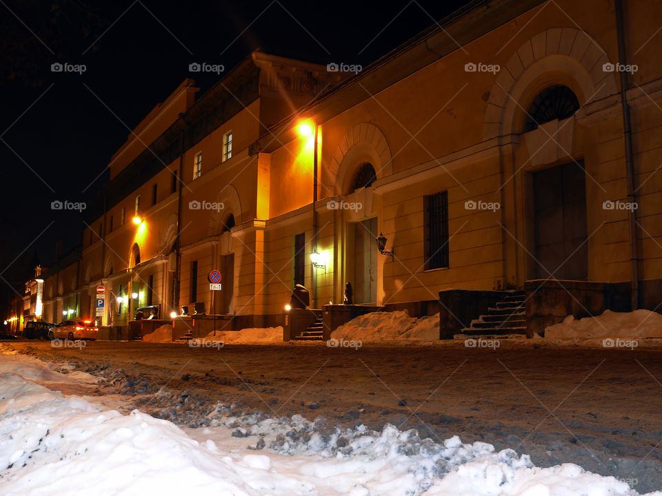 Illuminated building exterior by night in Riga, Latvia.