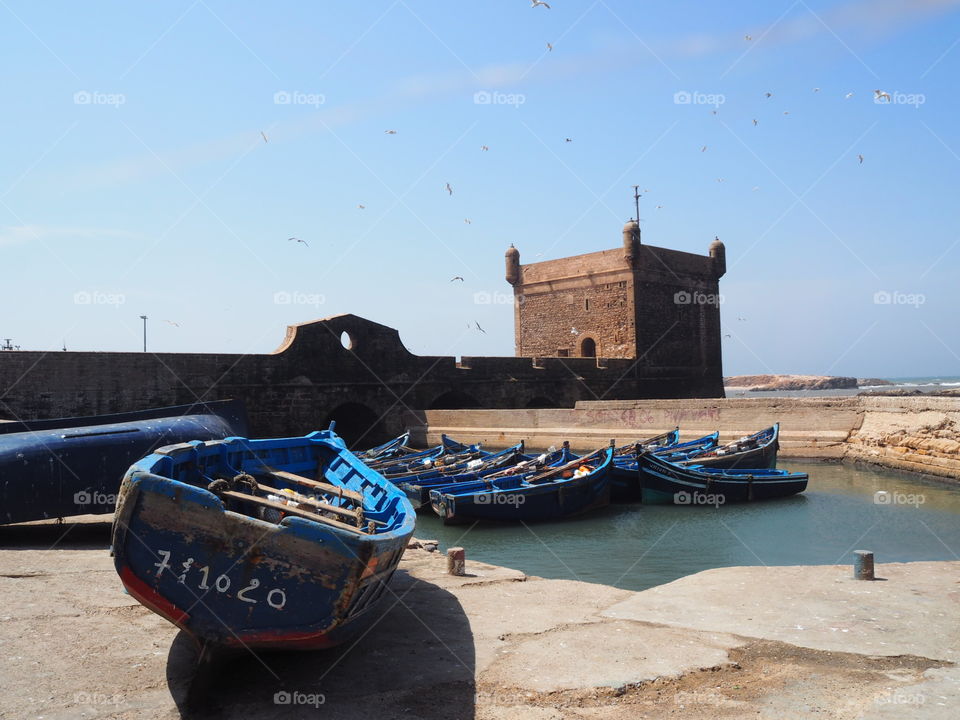 Boats docked at the fo