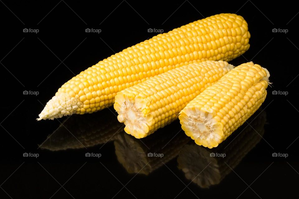 Yellow corn on black background