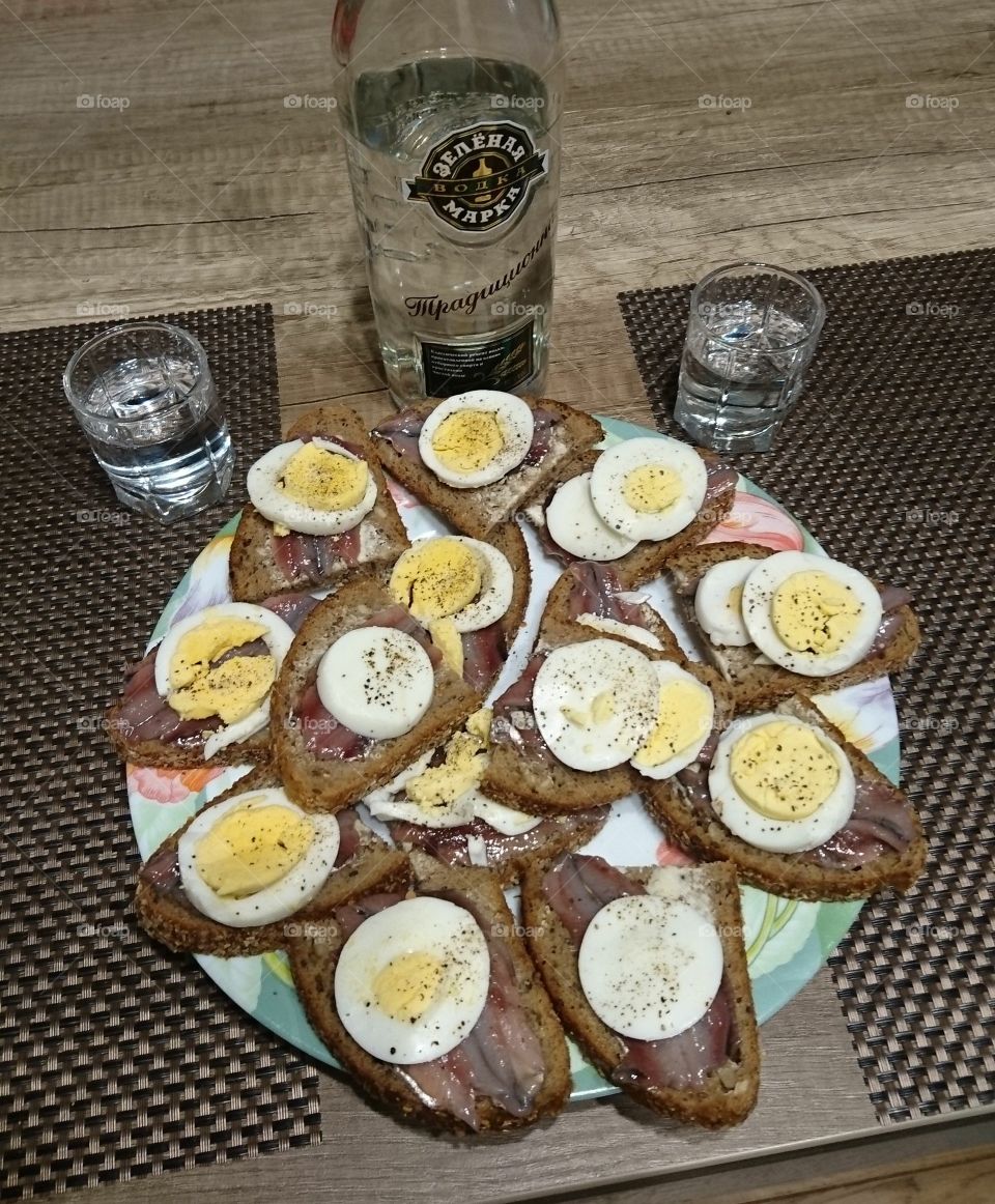evening with fish buns with egg and vodka
