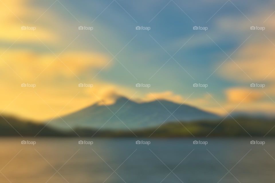 Abstract blur, view of the sea, hills and mountains in a blurred style. Blurred background.