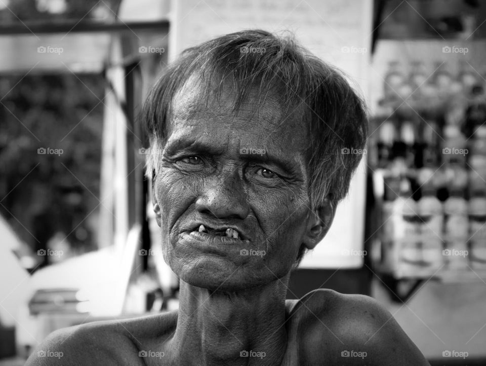 Eyes are the window to our soul. Portrait of the sad man on the street 