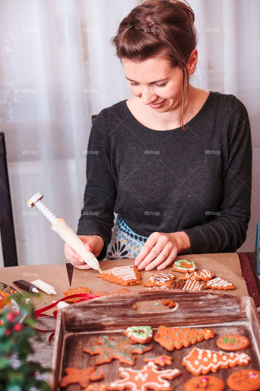 Smiling woman making cookies