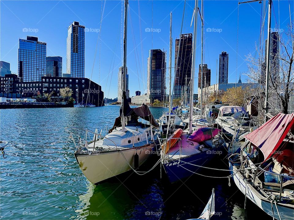 This is beautiful “Newtown Creek” by the “Pulaski Bridge” in LIC, Queens with lovely picturesque boats and the “East River” sparkling in the late afternoon sun on a warm sunny Indian summer day in early November 2023. Hypnotic Productions
