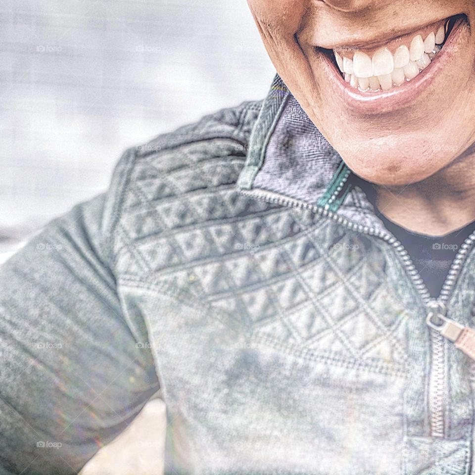 Woman’s smile, focus on the smile, smiling woman portrays the emotion of happiness, woman smiles for camera, close up of a woman smiling, bright white smile, happy smile 