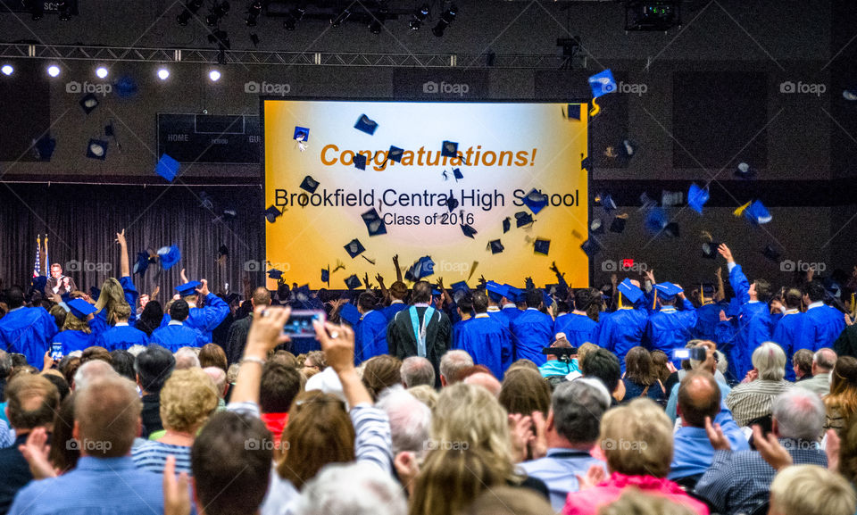 Students throwing hats at graduation ceremony