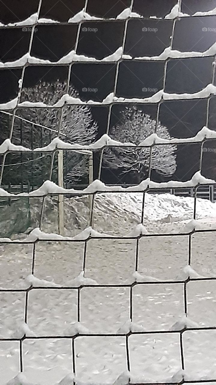 fresh snow and ice so light and white can stay on the football place at night