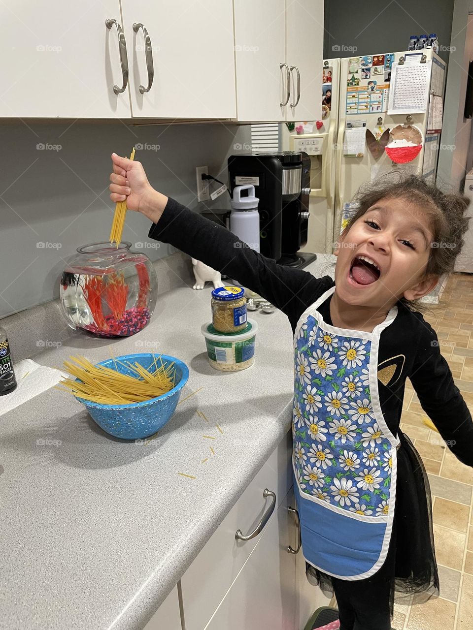 Success in the kitchen, making pasta with mommy, breaking pasta to cook better 