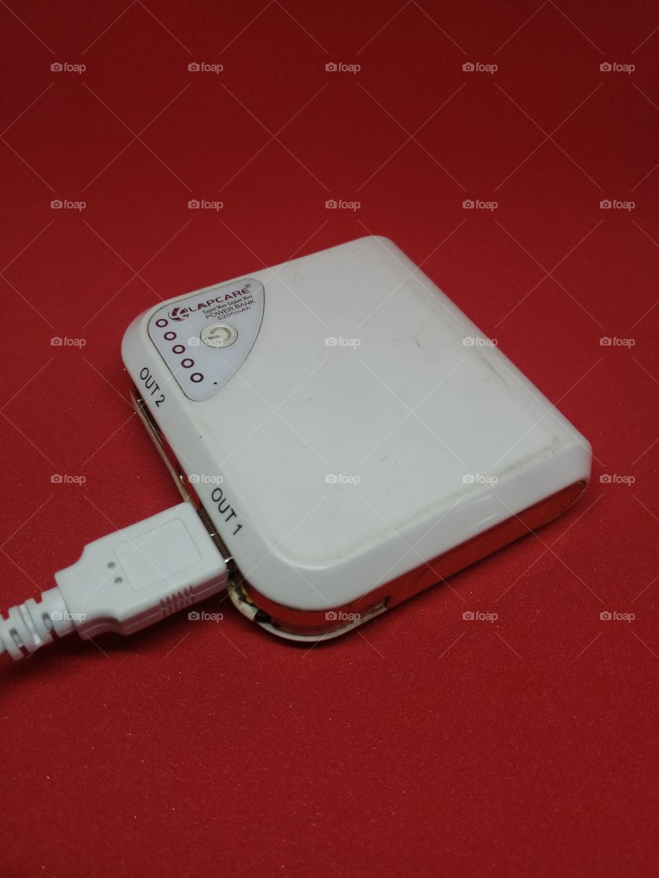 White color Power bank on red background
