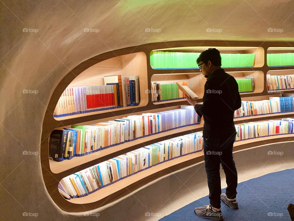 Reading Book in Library 