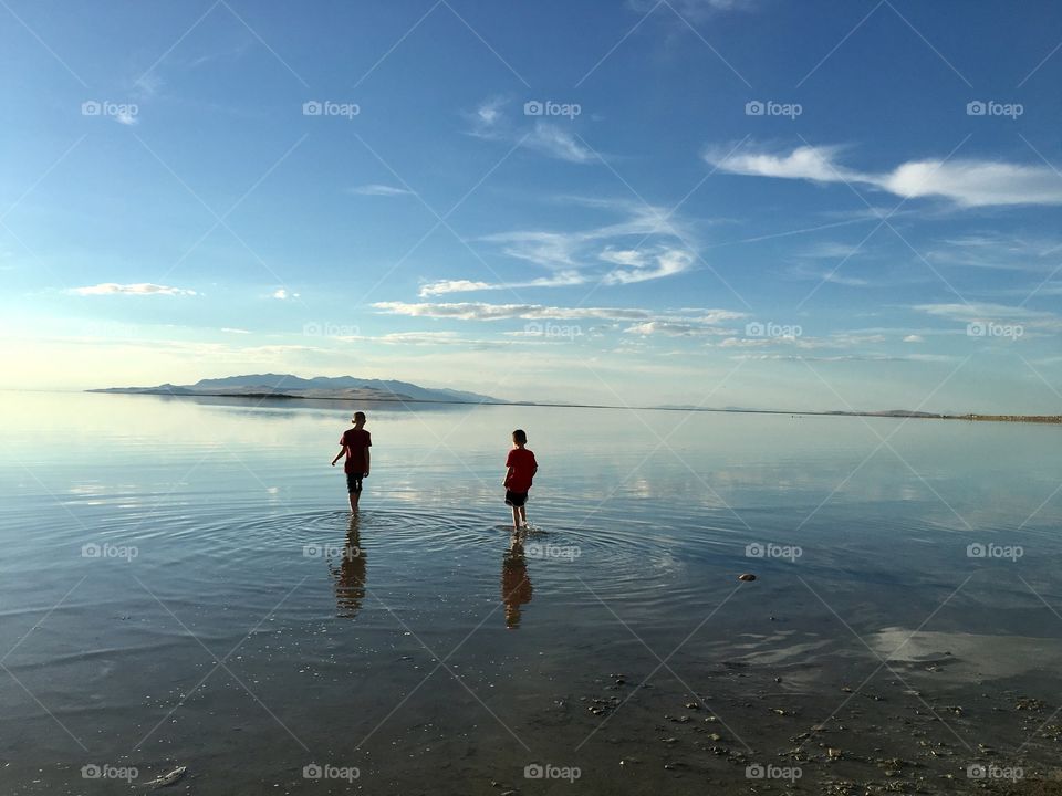Great Salt Lake. Utah. Boys in the water. Shallow water. Beautiful sunset. Beautiful vacation. Perfect time away.
