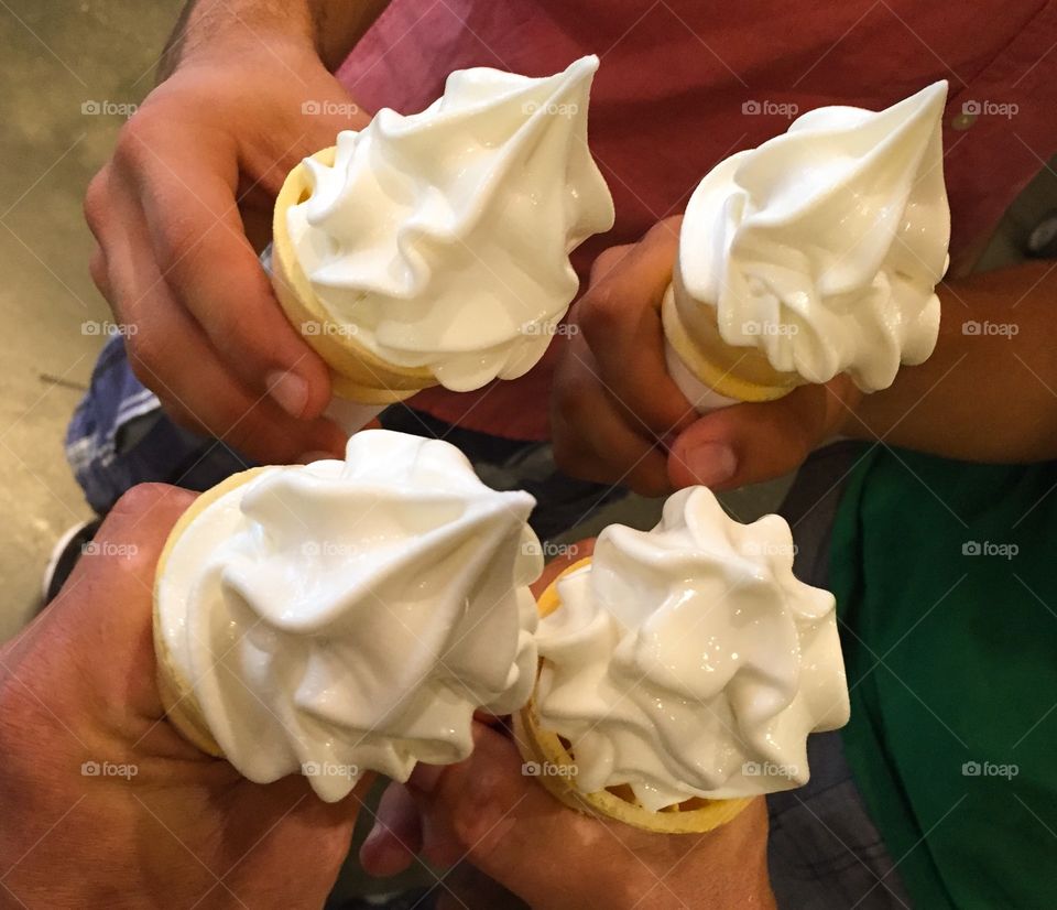 Hands holding ice cream