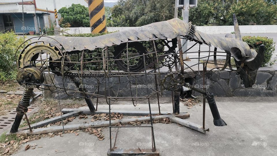 Iron armored cow in the park