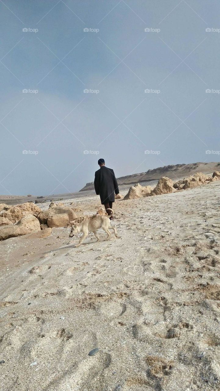 People walking with dog.