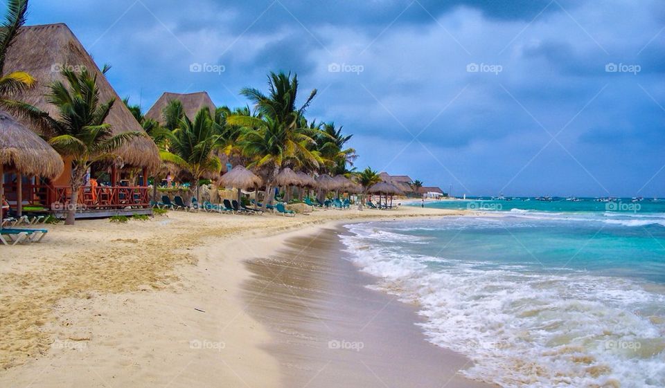 View of a beach against blue sky