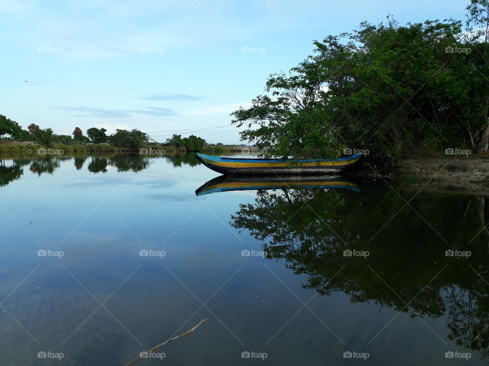 The river bank is a fishing boat