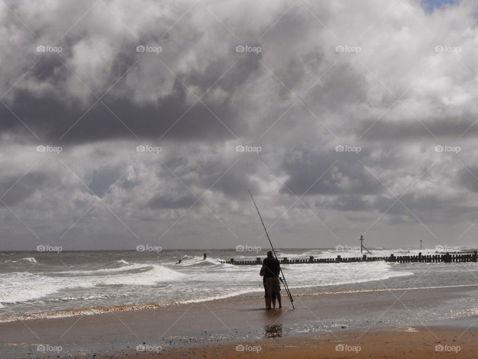 A fishing couple on the beach