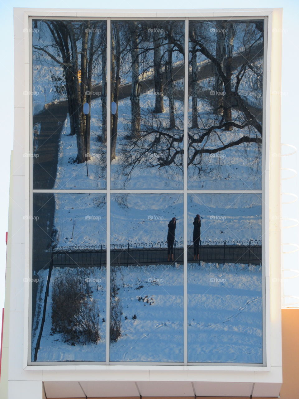 double reflection in the mirror installed on the facade of the building