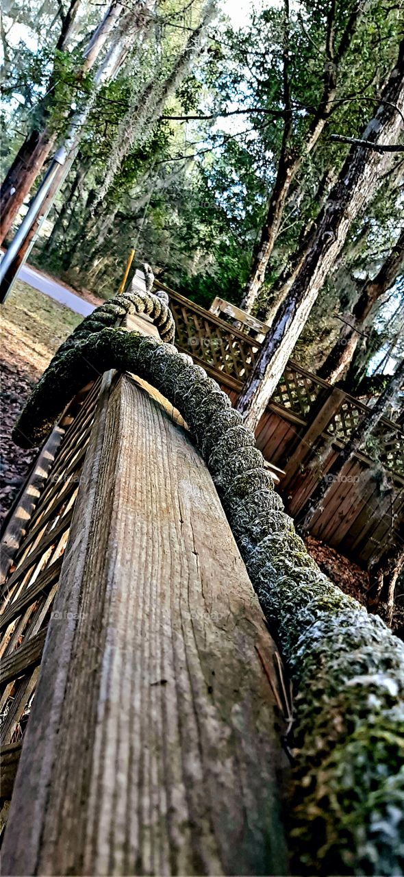 old rope on the fence rail