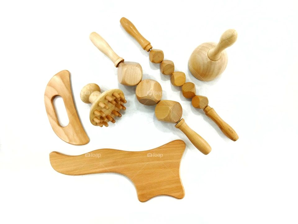 Wooden massage tools to stimulate the lymphatic system and improve circulation. Treatment to eliminate cellulite.