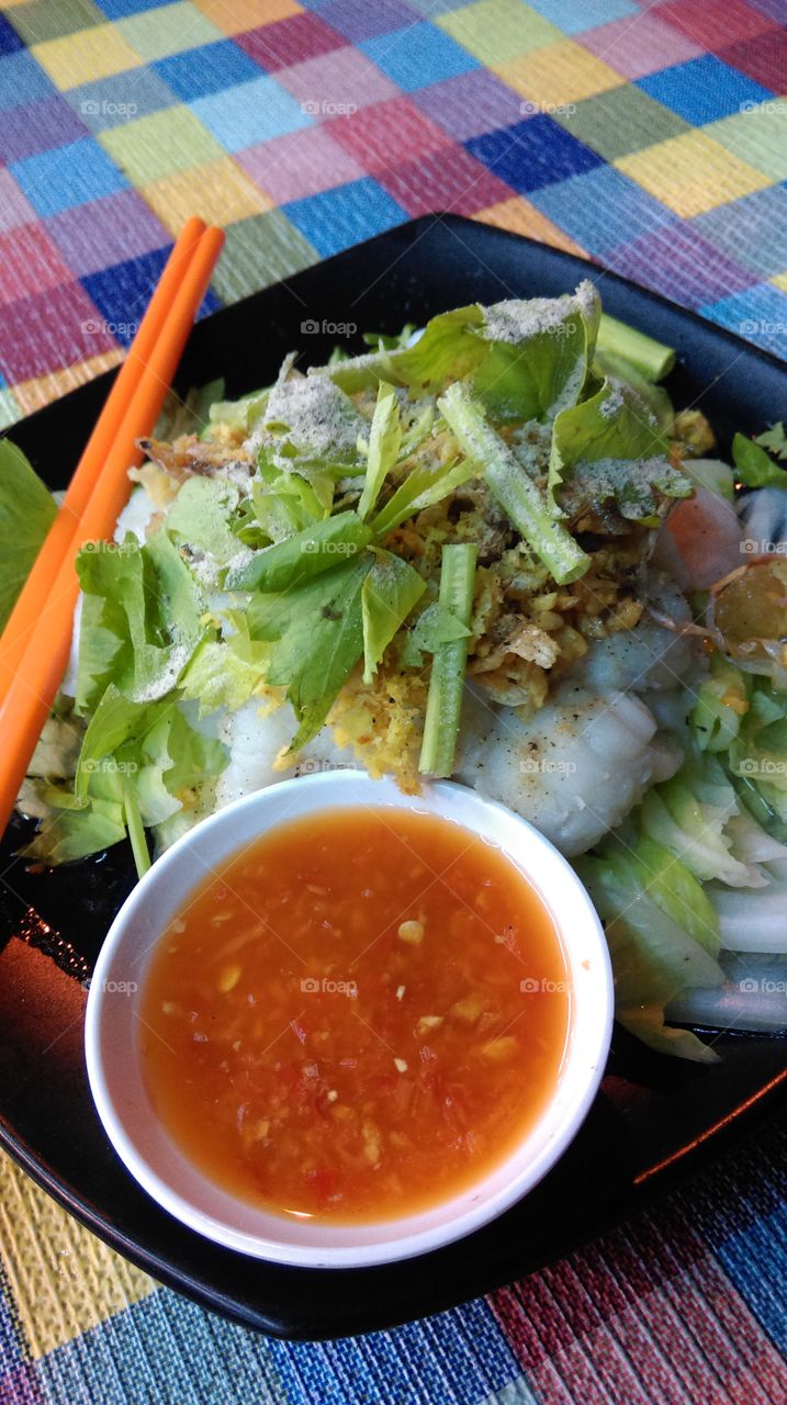 spicy sauce with sea bass and vegetables