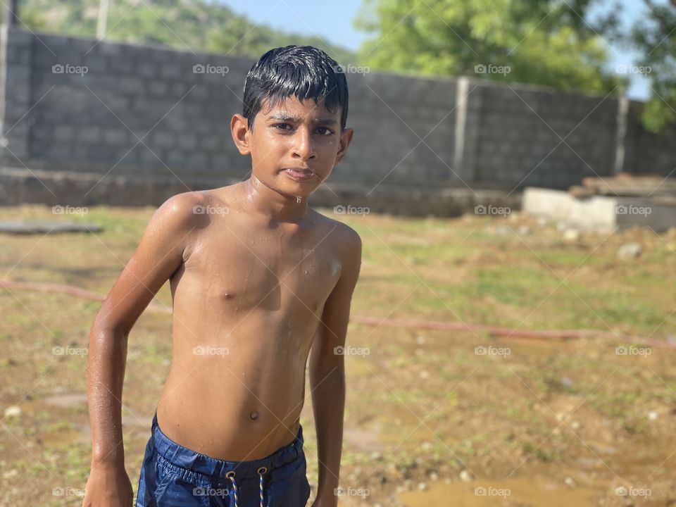 Portrait of a kid after he played in water