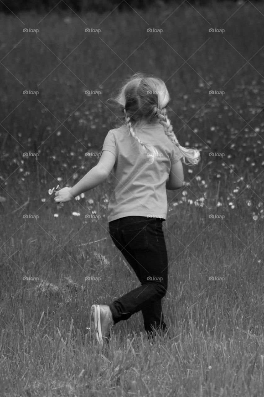 girl running with flowers