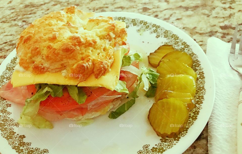 Ham &Cheese on a homemade yogurt and flour bagel with lettuce, tomato, onions! Garnish with Bread &Butter pickles! 