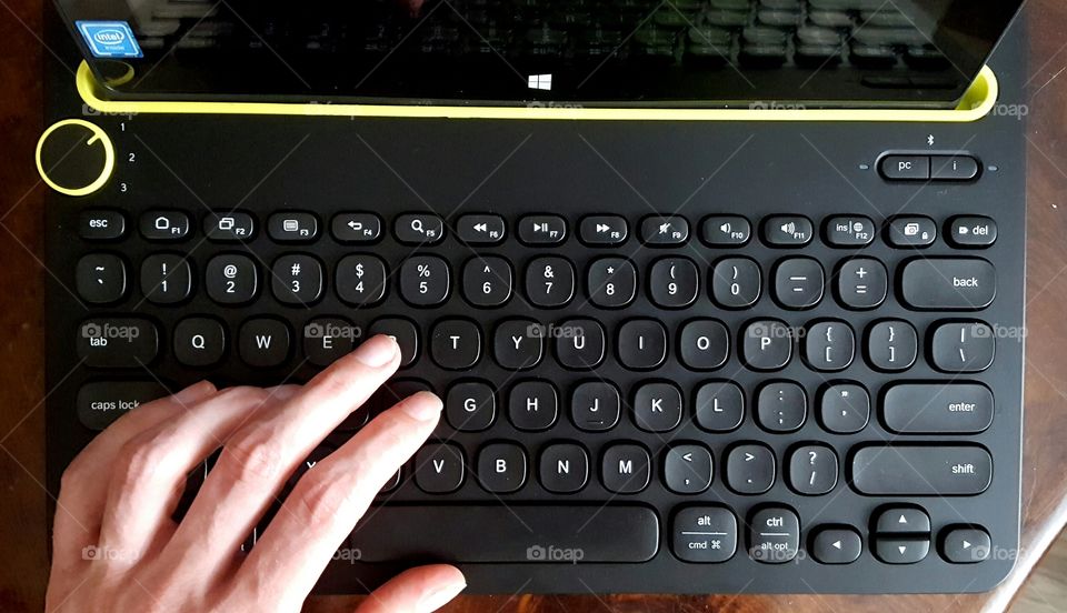 Typing on a Bluetooth keyboard.