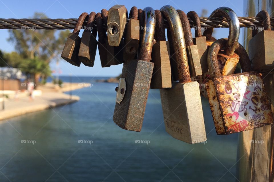 Locks of love  hanging on a bridge