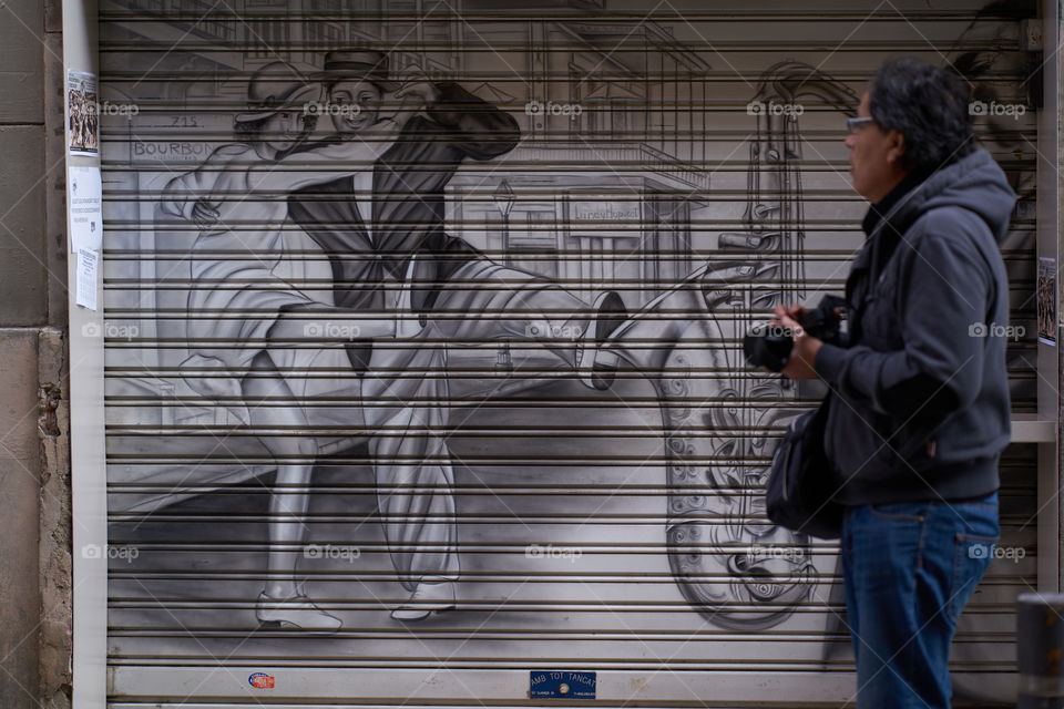 Man standing with camera in hand