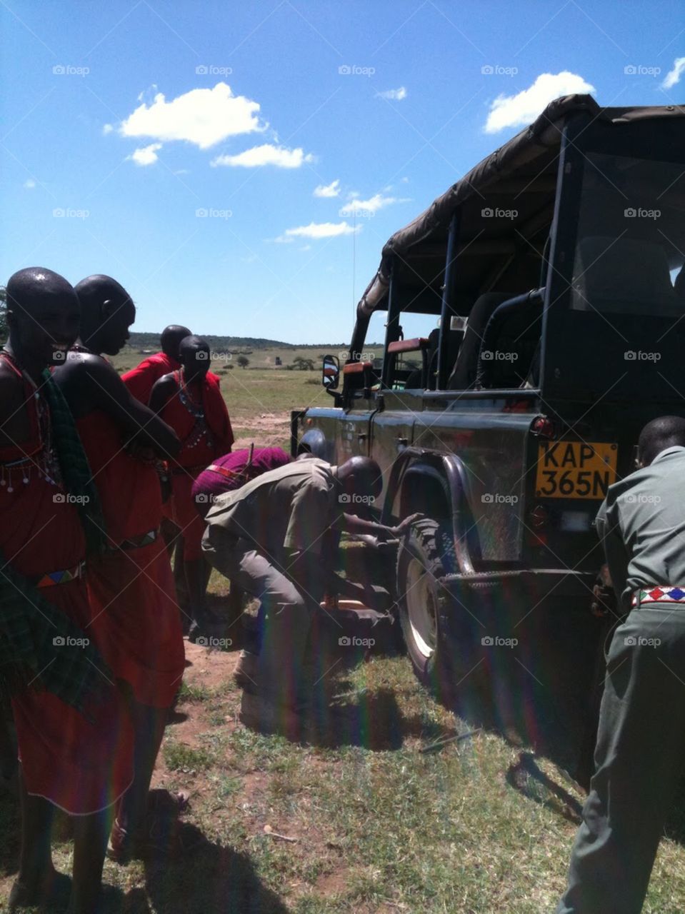 Time for a change of tyre in the wilderness, Mara, Kenya, Africa