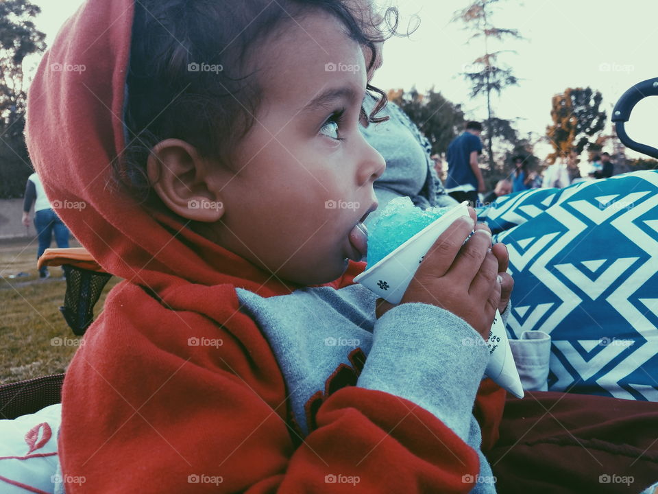 boy eating snow cone