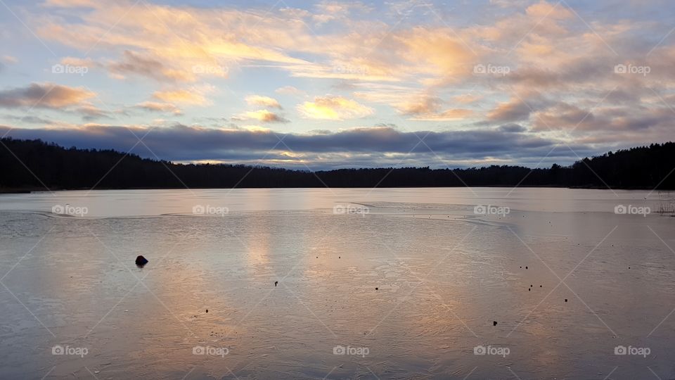 Sunset winter ice lake reflection , solnedgång vinter is sjö reflektion Härlanda Tjärn 