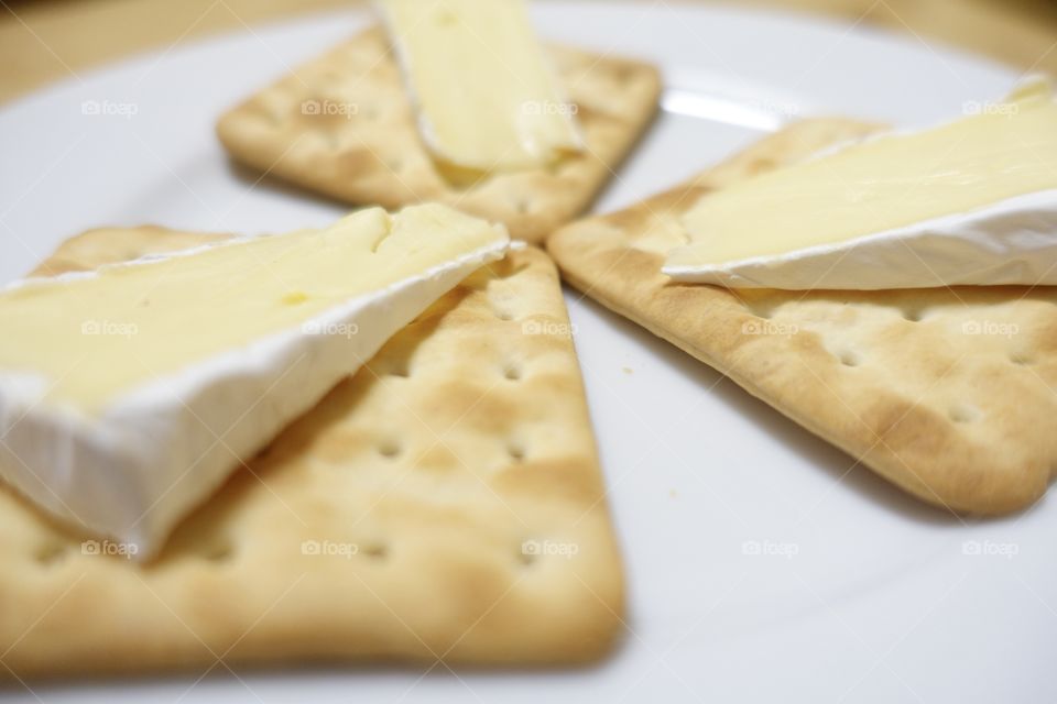 Cracker with Camembert cheese-close up image.