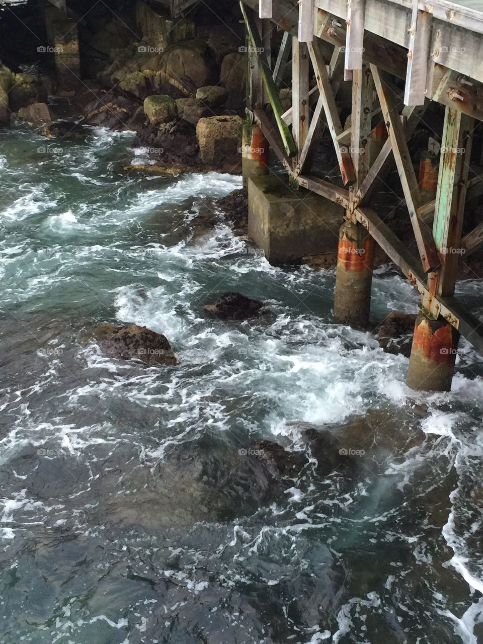 Water rushing under bridge