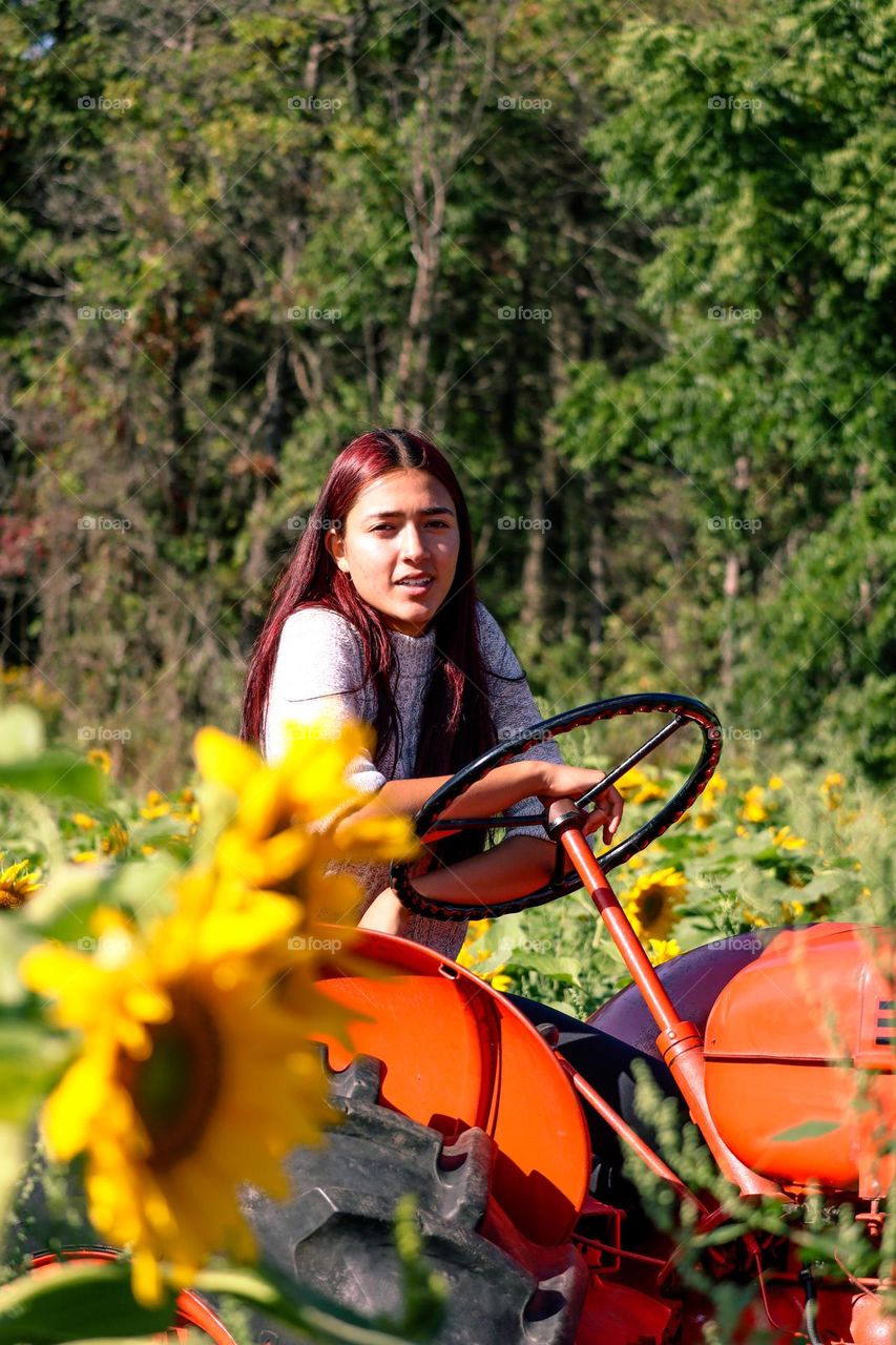 Young woman working at the farm