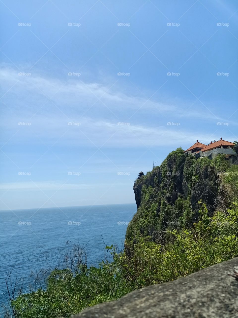 at the top of the cliff the Balinese pray their ritual belief